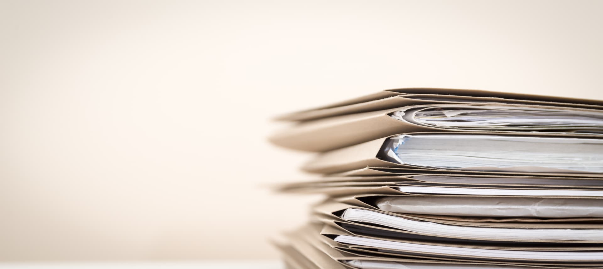 Stack of credentialing files awaiting verification